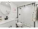Modern bathroom with a glass-enclosed shower and stylish fixtures at 600 Manatee Ave # 114, Holmes Beach, FL 34217