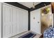 Bright entryway featuring white closet doors, and a decorative glass window at 600 Manatee Ave # 114, Holmes Beach, FL 34217