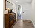 Welcoming entryway with classic cabinet, mirror, and decorative glass on the front door at 600 Manatee Ave # 114, Holmes Beach, FL 34217