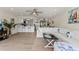 Spacious open-concept living room, view to kitchen, with stylish décor and ample natural light at 600 Manatee Ave # 114, Holmes Beach, FL 34217