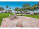 Inviting outdoor patio area with beautiful landscaping and ocean views, perfect for relaxing or entertaining at 600 Manatee Ave # 114, Holmes Beach, FL 34217