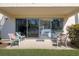 Outdoor patio with comfortable seating that provides an airy view to the interior at 600 Manatee Ave # 114, Holmes Beach, FL 34217