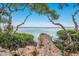 Scenic water view framed by lush greenery, offering a serene natural setting at 600 Manatee Ave # 114, Holmes Beach, FL 34217
