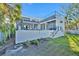 Exterior of home showing a modern design, upper patio, and a spiral staircase to the backyard at 603 Tremont St, Sarasota, FL 34242