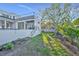 Modern backyard with a lawn, with a staircase leading to the rooftop deck at 603 Tremont St, Sarasota, FL 34242