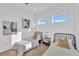 Bright bedroom featuring two twin beds, modern decor, and natural light from two windows at 603 Tremont St, Sarasota, FL 34242