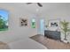 Bright bedroom with natural light, ceiling fan, stylish decor and an adjacent glass door at 603 Tremont St, Sarasota, FL 34242