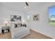 Bedroom with a soft bed, side tables with lamps, and decorative wall art at 603 Tremont St, Sarasota, FL 34242
