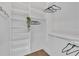 Bright closet space offering ample shelving and hanging storage for clothing and accessories at 603 Tremont St, Sarasota, FL 34242