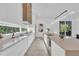Contemporary kitchen featuring a sleek island, modern cabinetry, and state-of-the-art appliances at 603 Tremont St, Sarasota, FL 34242
