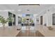 Open concept kitchen and dining area featuring a large island and elegant finishes at 603 Tremont St, Sarasota, FL 34242