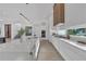 Modern kitchen with a large island, white countertops, and stainless steel appliances at 603 Tremont St, Sarasota, FL 34242