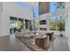 Spacious living room with high ceilings, large windows, fireplace, comfortable seating, and stylish decor at 603 Tremont St, Sarasota, FL 34242