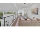 Cozy living room with modern railing, sleek finishes and natural light at 603 Tremont St, Sarasota, FL 34242
