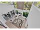 An aerial view of an airy living room with high ceilings, modern decor, and an outdoor entertaining area at 603 Tremont St, Sarasota, FL 34242