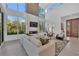 Bright and airy living room features a modern fireplace, large windows and comfortable seating at 603 Tremont St, Sarasota, FL 34242