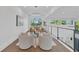 Cozy living room featuring contemporary furniture, natural light, and beautiful hardwood floors at 603 Tremont St, Sarasota, FL 34242