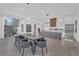 Bright, open-concept living space with modern dining table, kitchen, staircase, and stylish design at 603 Tremont St, Sarasota, FL 34242