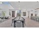 Spacious, open-concept living space with dining area, stylish staircase, and a cozy seating area at 603 Tremont St, Sarasota, FL 34242
