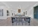 Modern, open-concept living space with stylish dining area, kitchen, and wine storage, perfect for entertaining guests at 603 Tremont St, Sarasota, FL 34242