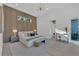 This main bedroom features a wood accent wall, natural light, and sleek furniture creating a serene atmosphere at 603 Tremont St, Sarasota, FL 34242