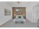 This main bedroom features a wood accent wall, natural light, and sleek furniture creating a serene atmosphere at 603 Tremont St, Sarasota, FL 34242