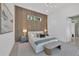 This main bedroom features a wood accent wall, natural light, and sleek furniture creating a serene atmosphere at 603 Tremont St, Sarasota, FL 34242