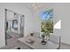 Bright office featuring a unique white desk, comfortable chairs, and large windows offering tranquil outdoor views at 603 Tremont St, Sarasota, FL 34242