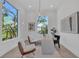 Bright office featuring a modern desk, elegant chairs, and large windows offering an abundance of natural light at 603 Tremont St, Sarasota, FL 34242