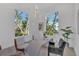 Bright office space with modern furniture, including a unique desk, a large window, and stylish decor at 603 Tremont St, Sarasota, FL 34242