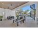 Enjoy outdoor living with a spacious patio, modern seating, dining area, and a spiral staircase to the upper floors at 603 Tremont St, Sarasota, FL 34242