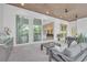 The outdoor space features plenty of seating, stainless steel appliances, a dining table, and lots of natural light at 603 Tremont St, Sarasota, FL 34242