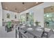 Outdoor space includes a kitchen, a dining set and views of the pool at 603 Tremont St, Sarasota, FL 34242