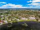 Stunning aerial view of waterfront condos surrounded by lush landscaping and neighborhood amenities at 6430 Sun Eagle Ln # 103, Bradenton, FL 34210