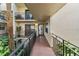 Exterior entrance of a condominium with lush greenery, leading to a welcoming entrance at 6430 Sun Eagle Ln # 103, Bradenton, FL 34210