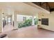 Well-lit hallway with access to units, mailbox, and a view of the tropical landscaping at 6430 Sun Eagle Ln # 103, Bradenton, FL 34210