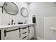 Stylish bathroom with a double vanity, modern fixtures, and contemporary design at 701 37Th Avenue E Dr, Bradenton, FL 34208