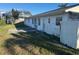 Backyard with a patio area, lawn, and views of neighboring properties at 704 Chippy Ln, Nokomis, FL 34275