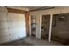 This is a garage with a white door and storage shelves at 704 Chippy Ln, Nokomis, FL 34275