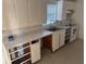 Image of a kitchen area with basic appliances and partially installed cabinetry at 704 Chippy Ln, Nokomis, FL 34275
