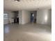 View of a combined living room and kitchen area with basic appliances and fixtures at 704 Chippy Ln, Nokomis, FL 34275