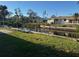 Waterfront property with canal access, docks, and lush greenery at 704 Chippy Ln, Nokomis, FL 34275