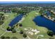 Scenic aerial view of the golf course and surrounding community with mature landscaping at 7052 Woodmore Ter, Lakewood Ranch, FL 34202