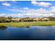Scenic view of the community pond from the home's backyard at 7052 Woodmore Ter, Lakewood Ranch, FL 34202
