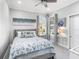 Comfortable bedroom featuring neutral colors, soft carpet and plentiful natural light at 7052 Woodmore Ter, Lakewood Ranch, FL 34202