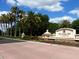 Elegant entrance to The Country Club at Lakewood Ranch, featuring lush landscaping and a welcoming sign at 7052 Woodmore Ter, Lakewood Ranch, FL 34202