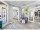 Inviting entryway featuring an arched doorway, decorative niche, and view into the kitchen at 7052 Woodmore Ter, Lakewood Ranch, FL 34202