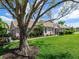 Charming single-story home featuring mature landscaping and a meticulously maintained lawn at 7052 Woodmore Ter, Lakewood Ranch, FL 34202
