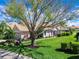 Charming single-story home featuring mature landscaping and a meticulously maintained lawn at 7052 Woodmore Ter, Lakewood Ranch, FL 34202