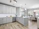 Bright, spacious kitchen with gray cabinets, stainless steel appliances, and a center island at 7052 Woodmore Ter, Lakewood Ranch, FL 34202
